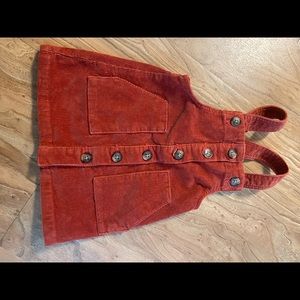 Little Girls corduroy jumpers in orange and cheetah.